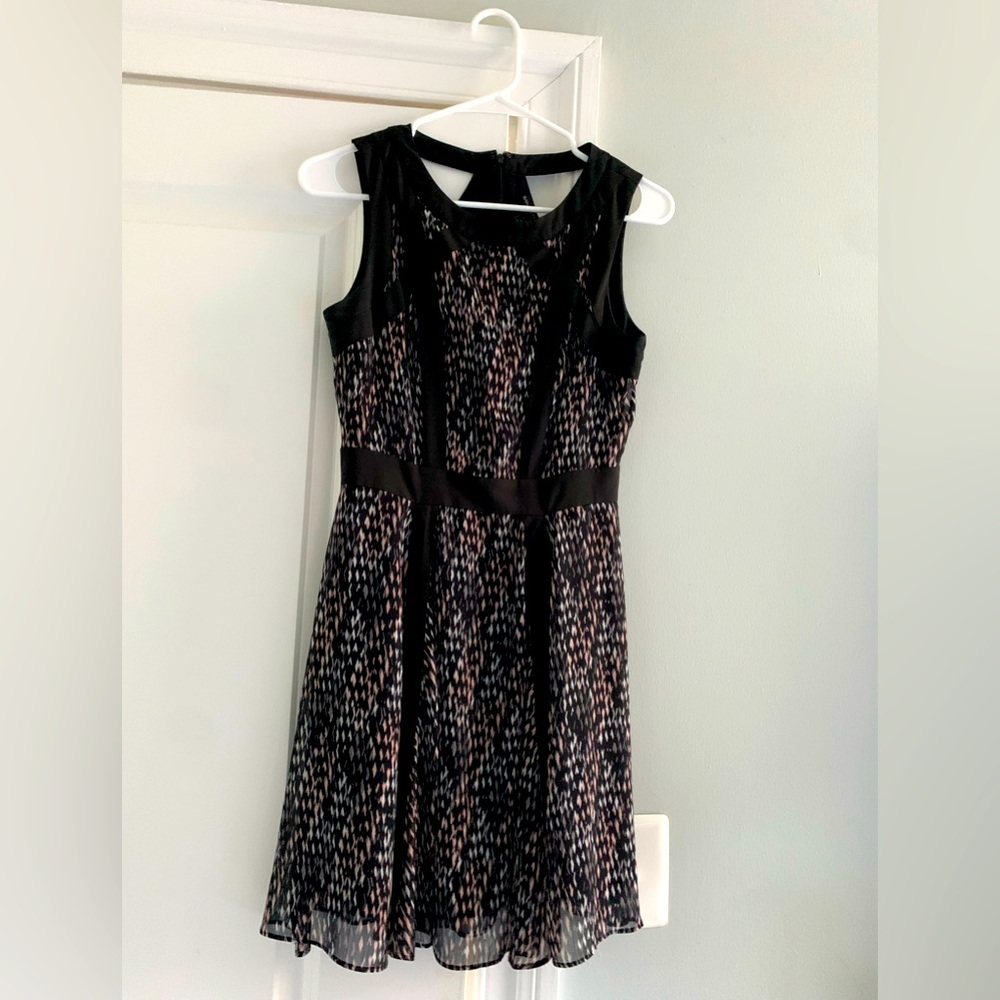 Beautiful and Flattering Fit and Flare A Line Dress w/Cutout Detail in the Black